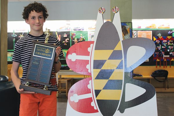 Sixth grader Henry Turner poses with his spelling bee trophy.